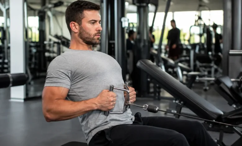 10 Best Cable Back Exercises for a Bigger Back 13 Man performing a seated cable row, one of the best cable back exercises