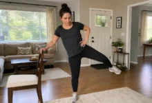 Woman performing standing leg raises for hip strength