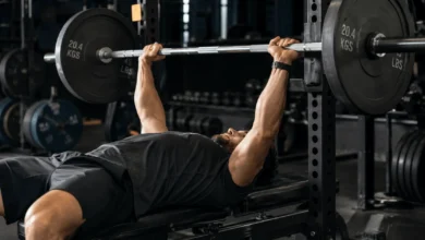 Lifter performing a barbell bench press as part of a push pull legs upper lower split