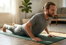 Person holding a cobra stretch on a yoga mat at home